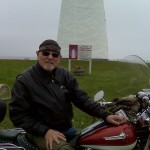 Dick Young on his motorcycle at Point Prim Lighthouse.