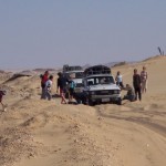 Digging out and pushing the jeeps—part of the fun on an adventure tour